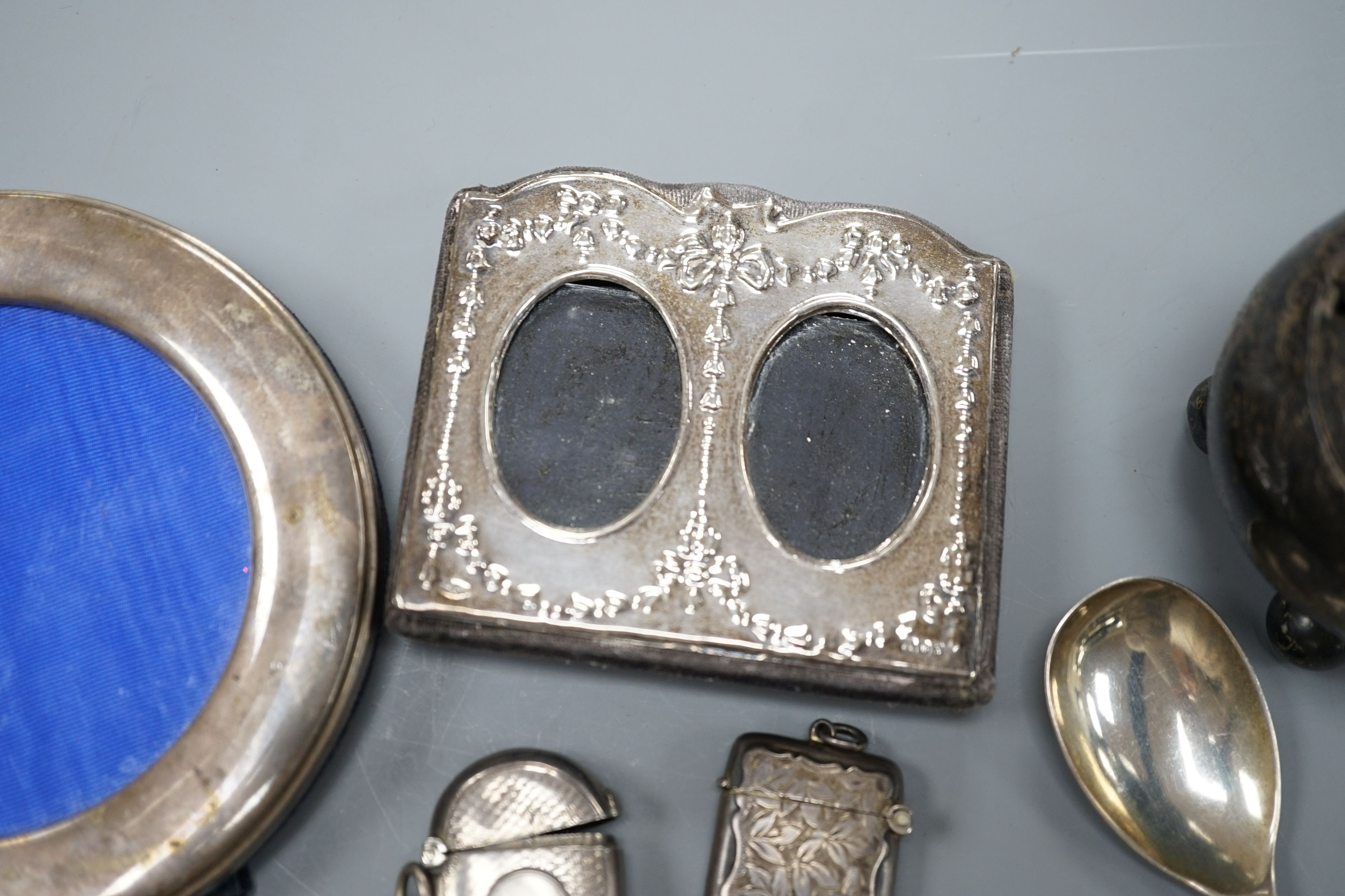 A pair of George III silver grape scissors, by Eley & Fearn, London, 1818 and a George V silver replica of the anointing spoon, Goldsmiths & Silversmiths Co Ltd, London 1910, 166 grams.